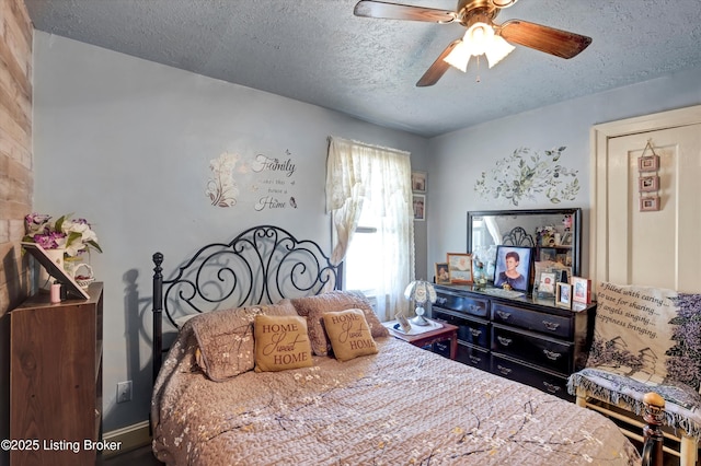 bedroom with baseboards, a textured ceiling, and ceiling fan
