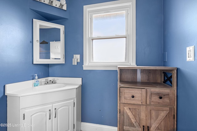 bathroom with baseboards and vanity