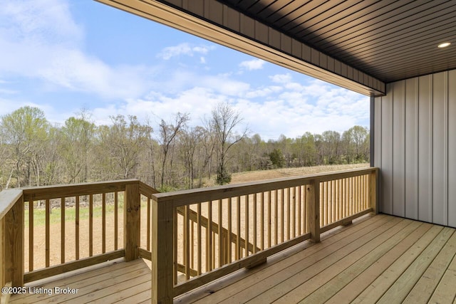 wooden deck with a view of trees