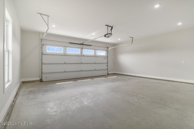 garage with recessed lighting, baseboards, and a garage door opener