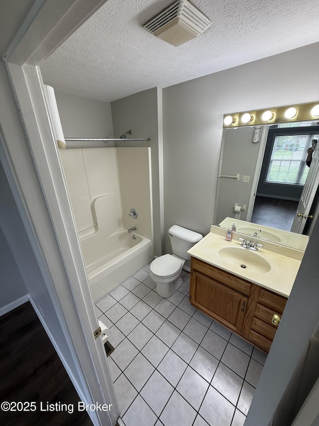 7213 Hassock Dr, Louisville, KY 40258 - bathroom featuring visible vents, toilet, shower / bathing tub combination, a textured ceiling, and vanity