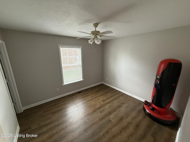 7213 Hassock Dr, Louisville, KY 40258 - interior space featuring visible vents, baseboards, a textured ceiling, and dark wood finished floors