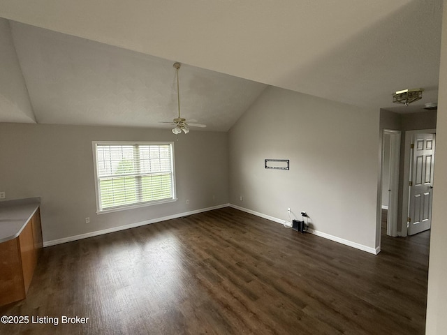 7213 Hassock Dr, Louisville, KY 40258 - interior space with ceiling fan, dark wood-style flooring, baseboards, and vaulted ceiling