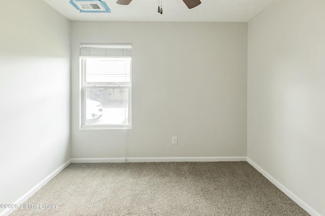 carpeted empty room featuring ceiling fan, baseboards, and visible vents