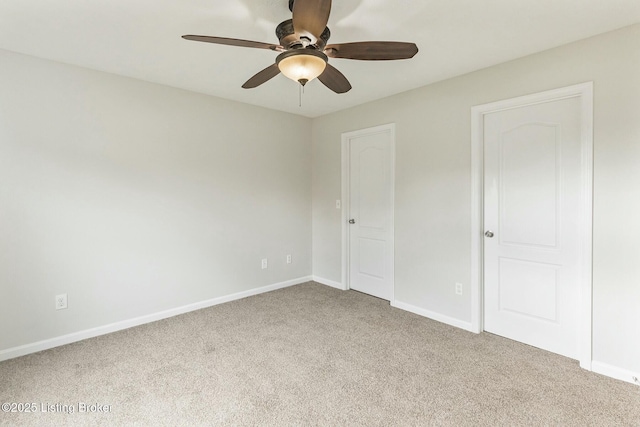 unfurnished bedroom featuring carpet, baseboards, and ceiling fan