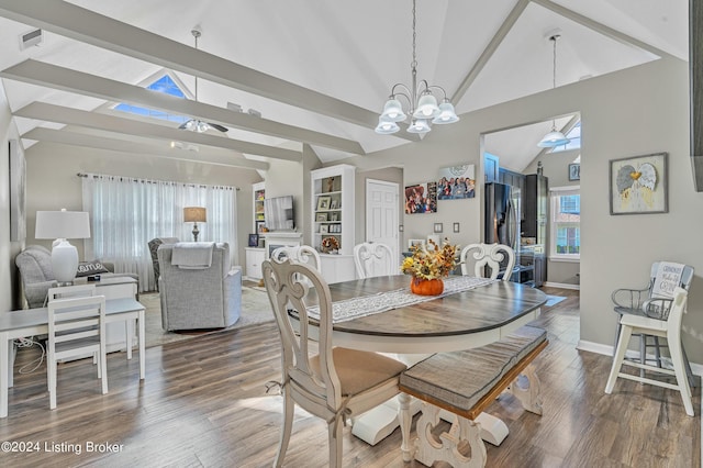dining space with wood finished floors, beamed ceiling, baseboards, high vaulted ceiling, and ceiling fan with notable chandelier