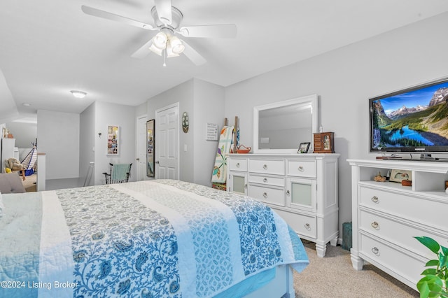 bedroom with ceiling fan and light colored carpet