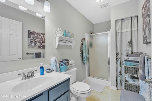 bathroom with a shower stall, vanity, baseboards, toilet, and visible vents