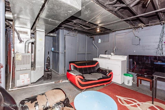 unfinished below grade area featuring washer and dryer