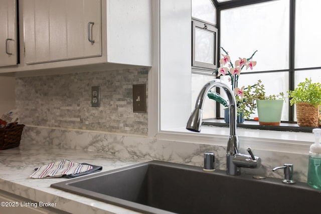 7407 Meadow Rd, Crestwood, KY 40014 - kitchen view of a sink, decorative backsplash, and light countertops