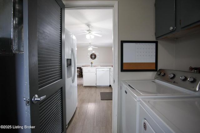 7407 Meadow Rd, Crestwood, KY 40014 - washroom featuring cabinet space, washing machine and dryer, light wood finished floors, and ceiling fan