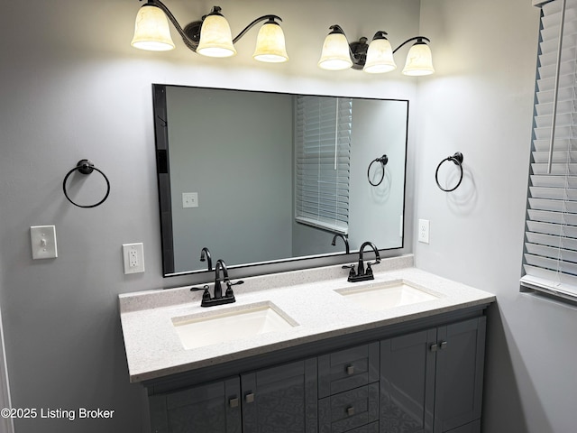 bathroom featuring a sink and double vanity