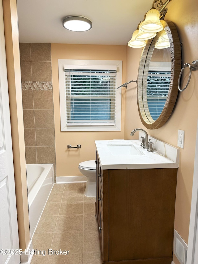 bathroom featuring tile patterned flooring, visible vents, toilet, vanity, and baseboards