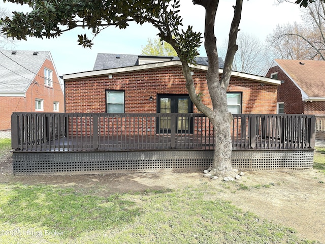 back of house with a wooden deck and brick siding