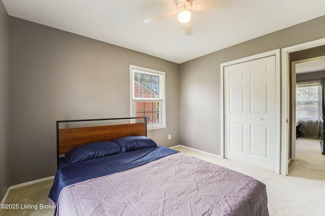 10000 Charleswood Rd, Louisville, KY 40229 - carpeted bedroom featuring a ceiling fan, baseboards, and multiple windows