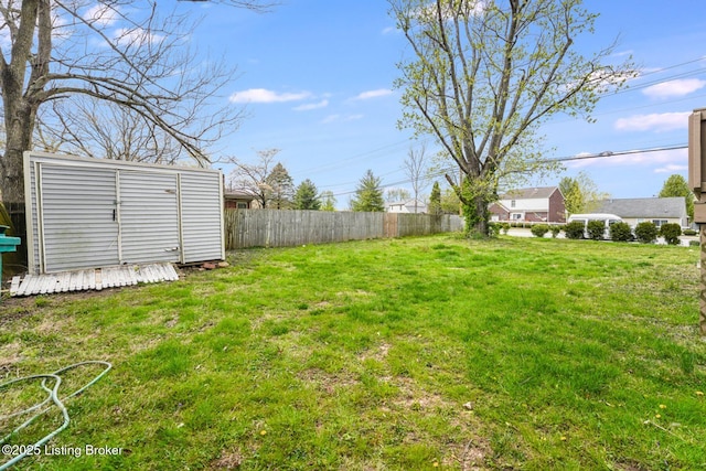 10000 Charleswood Rd, Louisville, KY 40229 - view of yard featuring an outdoor structure, a storage unit, and fence