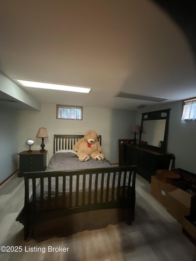 bedroom with wood finished floors