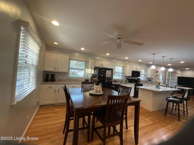 dining space with recessed lighting, light wood finished floors, baseboards, and ceiling fan