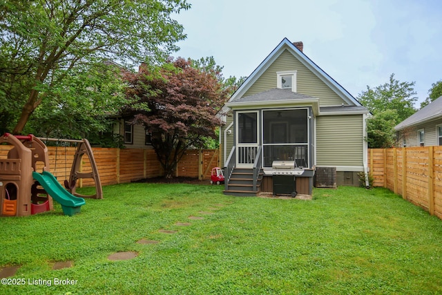 216 Cornell Pl, Louisville, KY 40207 - back of property with a playground, a sunroom, a chimney, and cooling unit