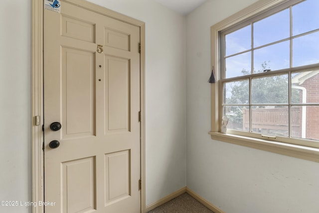 interior space featuring baseboards