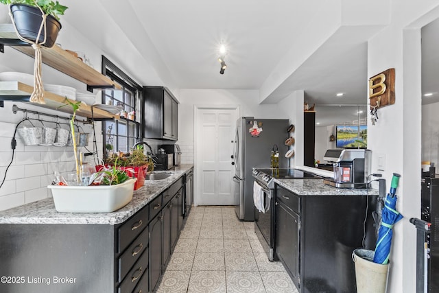 kitchen featuring open shelves, stainless steel appliances, a sink, and backsplash