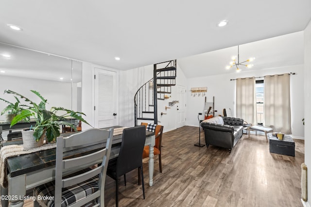 dining space with recessed lighting, wood finished floors, baseboards, a chandelier, and stairs