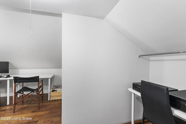 office area with vaulted ceiling and wood finished floors