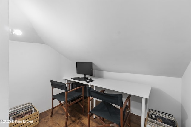 office with vaulted ceiling and wood finished floors