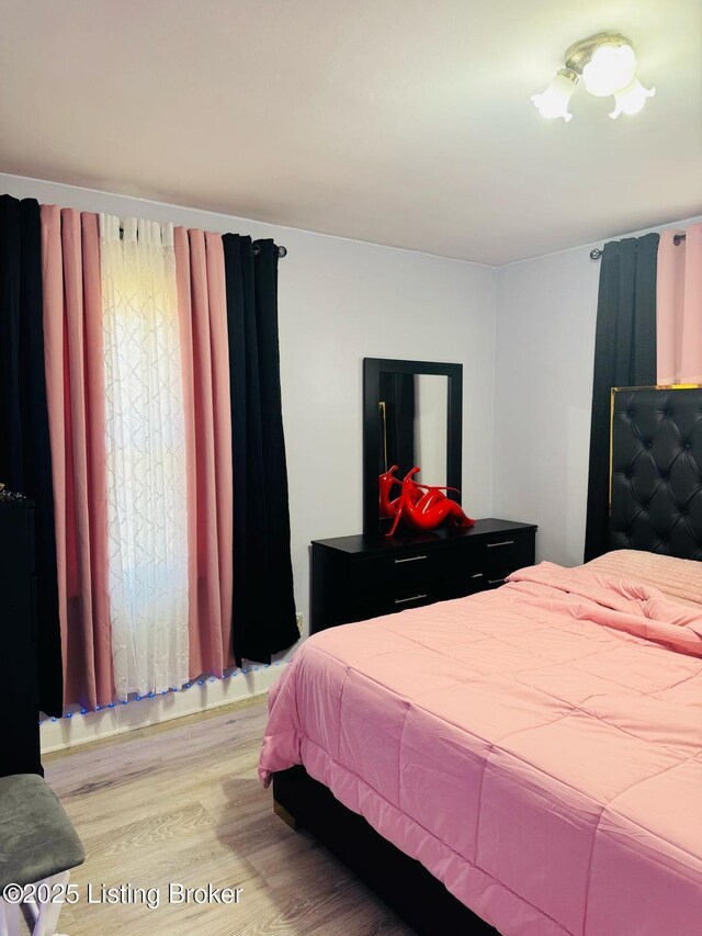 bedroom with light wood-style flooring