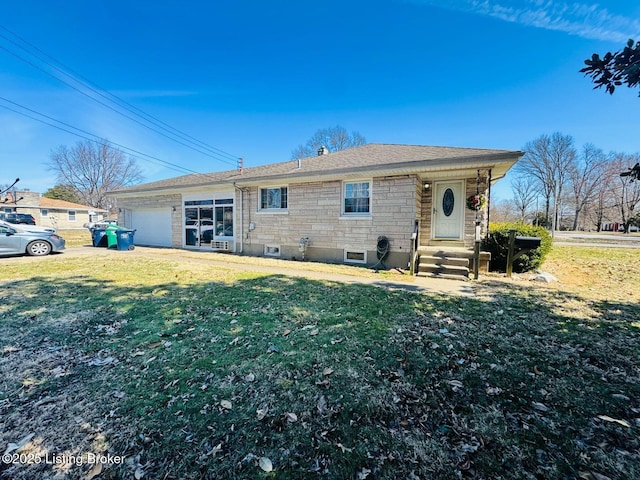 view of front of home featuring an attached garage, a shingled roof, and a front lawn
