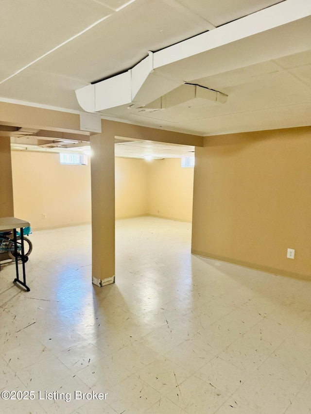 basement featuring light floors
