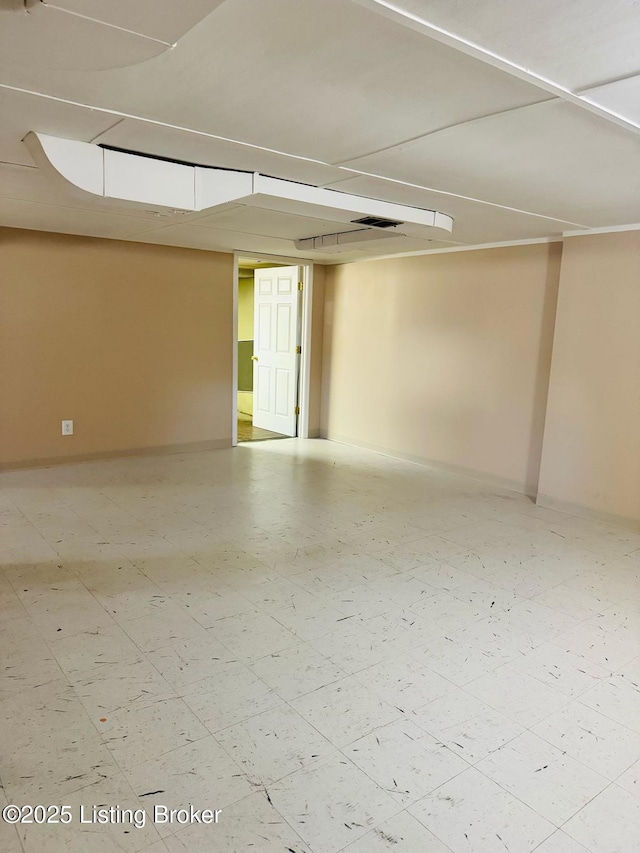 spare room featuring visible vents and baseboards