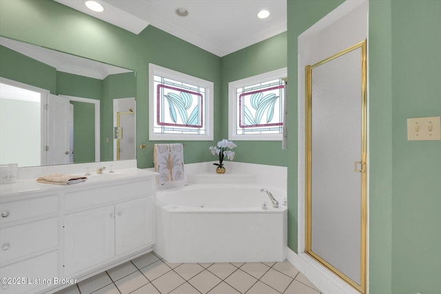 bathroom with a bath, vanity, tile patterned flooring, and a shower stall