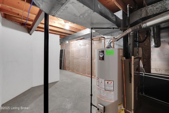 unfinished basement featuring water heater