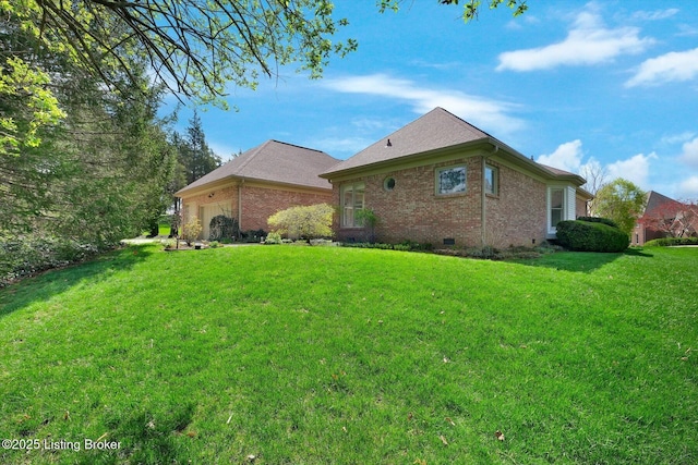 view of property exterior featuring brick siding, an attached garage, crawl space, and a lawn