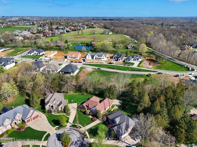 birds eye view of property featuring a residential view and a water view