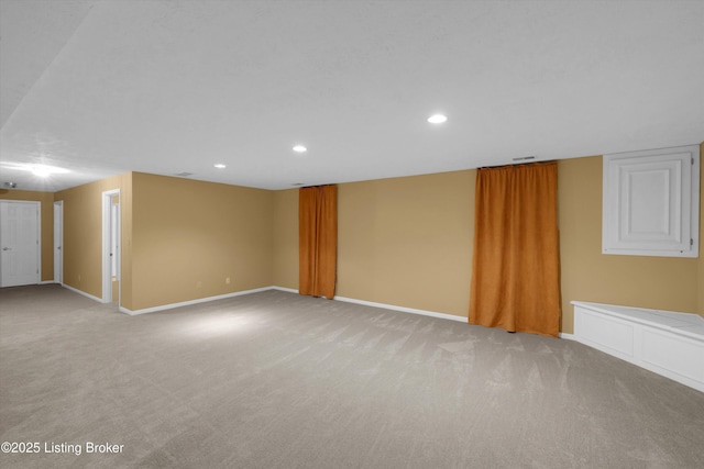 interior space with baseboards, carpet flooring, visible vents, and recessed lighting