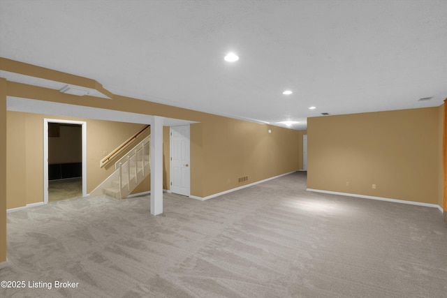 finished basement with baseboards, carpet flooring, stairs, and recessed lighting