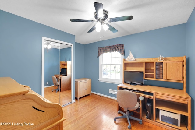 home office with baseboards, light wood-style floors, and ceiling fan