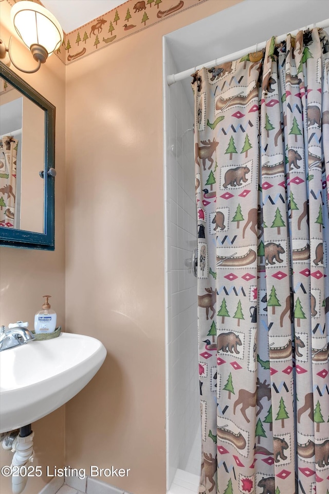 bathroom with a shower with curtain