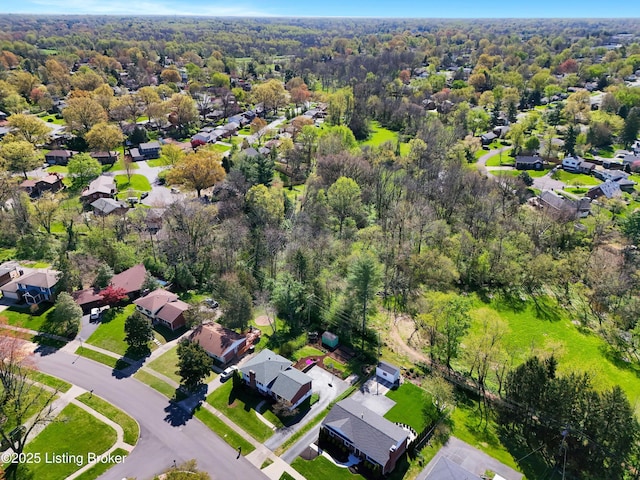 birds eye view of property featuring a forest view and a residential view
