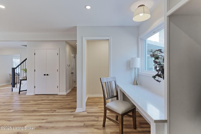 office area with light wood-style flooring, baseboards, and recessed lighting