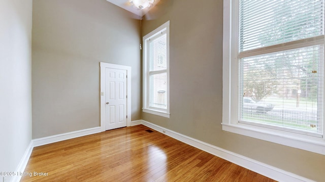 1031 S 7th St, Louisville, KY 40203 - empty room featuring wood finished floors and baseboards