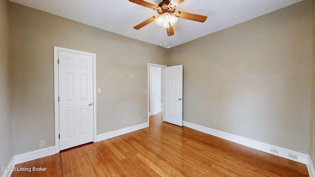 1031 S 7th St, Louisville, KY 40203 - spare room featuring light wood finished floors, baseboards, and a ceiling fan