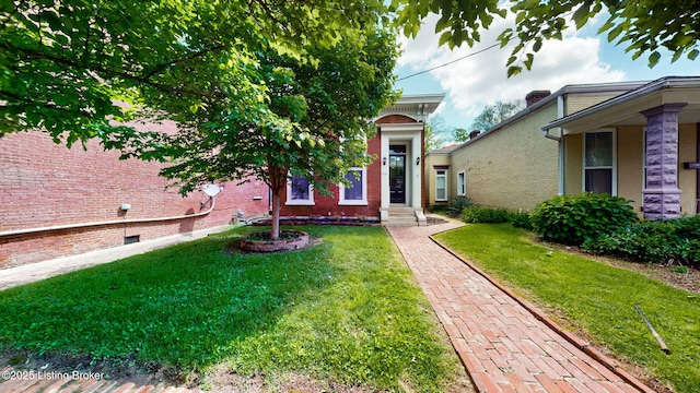 1031 S 7th St, Louisville, KY 40203 - view of front of property with a front yard and brick siding