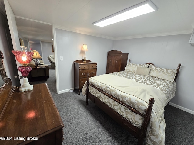 carpeted bedroom featuring crown molding and baseboards