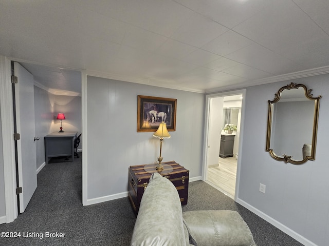 corridor with baseboards, dark carpet, and crown molding