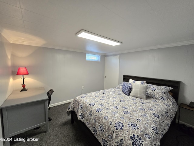 bedroom with carpet flooring, baseboards, and ornamental molding