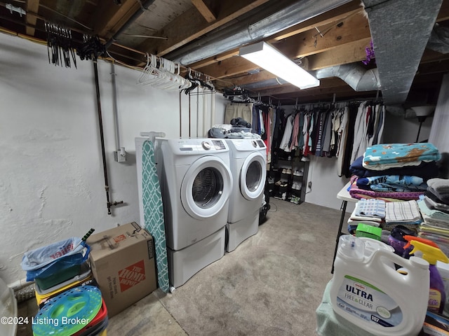laundry room featuring washing machine and dryer and laundry area