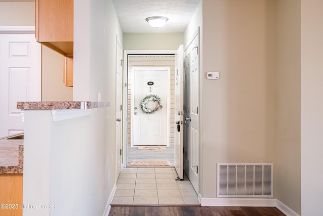 10202 Deer Vista Dr Unit 202, Louisville, KY 40291 - foyer featuring baseboards and light wood finished floors